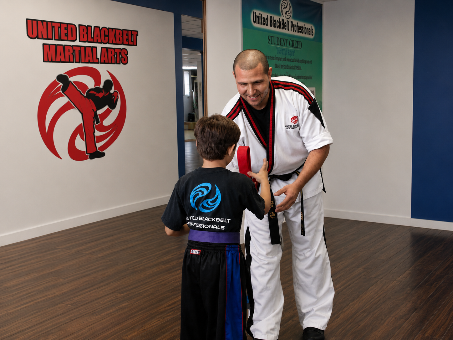 Instructor presenting a red belt to a young martial arts student in our Bronx gym